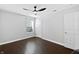 Inviting bedroom features hardwood floors, a ceiling fan, and an adjacent bathroom at 851 Pine Lake Dr, Greenwood, IN 46143