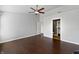 Spacious bedroom boasting hardwood floors, a ceiling fan, and access to the bathroom at 851 Pine Lake Dr, Greenwood, IN 46143