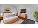 Cozy bedroom featuring a comfortable bed, stylish decor, and a mounted TV at 851 Pine Lake Dr, Greenwood, IN 46143