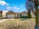 Attractive brick home with an attached two-car garage and manicured landscaping at 851 Pine Lake Dr, Greenwood, IN 46143