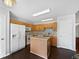Functional kitchen with an island, tile backsplash, wooden cabinets, and modern appliances at 851 Pine Lake Dr, Greenwood, IN 46143