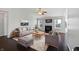 Inviting living room with high ceilings, a ceiling fan, fireplace, and abundant natural light at 851 Pine Lake Dr, Greenwood, IN 46143