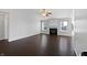 Bright living room with dark hardwood floors, fireplace, and many windows at 851 Pine Lake Dr, Greenwood, IN 46143