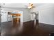Bright open-concept living room boasts hardwood floors, high ceilings, and easy access to the kitchen at 851 Pine Lake Dr, Greenwood, IN 46143