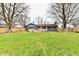 Expansive backyard featuring a well-maintained lawn, privacy fence, and mature trees at 9053 Sunset Ln, Brownsburg, IN 46112