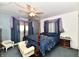 Comfortable bedroom featuring a four post bed, soft lighting, and ample natural light at 9053 Sunset Ln, Brownsburg, IN 46112