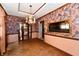 Elegant dining room featuring hardwood floors, floral wallpaper, chandelier and glass display case at 9053 Sunset Ln, Brownsburg, IN 46112