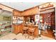 Cozy kitchen with an eat-in bar, wooden cabinets and stylish decor at 9053 Sunset Ln, Brownsburg, IN 46112