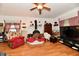 Inviting living room with hardwood floors, fireplace, and cozy seating arrangement at 9053 Sunset Ln, Brownsburg, IN 46112