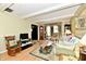 Inviting living room with hardwood floors, cozy seating, and large windows at 9053 Sunset Ln, Brownsburg, IN 46112