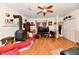 Comfortable living room featuring a fireplace, wood floors, and built-in shelves at 9053 Sunset Ln, Brownsburg, IN 46112