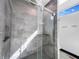 Stunning bathroom with modern glass shower, sleek tiling, and convenient built-in shelving at 917 Buchanan St, Indianapolis, IN 46203