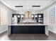 Modern kitchen features a large island, stainless steel appliances, and custom cabinetry at 917 Buchanan St, Indianapolis, IN 46203