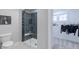 Bathroom view showcasing a glass enclosed shower with subway tile and walk-in closet at 9184 Anthem Ave, Plainfield, IN 46168