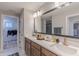 Modern bathroom featuring a double vanity with quartz countertop and decorative accents at 9184 Anthem Ave, Plainfield, IN 46168