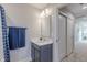 This bathroom features a gray vanity, modern lighting, and access to the hallway at 9184 Anthem Ave, Plainfield, IN 46168