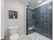 Bathroom showcasing a glass enclosed shower with subway tile and modern toilet at 9184 Anthem Ave, Plainfield, IN 46168