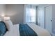 Comfortable bedroom features window with white curtains and sliding-door closet at 9184 Anthem Ave, Plainfield, IN 46168