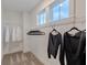 Well-lit closet with ample hanging space and wire shelving with carpet flooring at 9184 Anthem Ave, Plainfield, IN 46168
