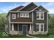 Charming two-story home with gray siding, a covered porch, and a well-manicured lawn at 9184 Anthem Ave, Plainfield, IN 46168