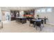 Open kitchen with a large island, modern appliances, and adjacent dining area at 9184 Anthem Ave, Plainfield, IN 46168