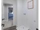 The laundry room provides access to a bedroom with blue furnishings at 9184 Anthem Ave, Plainfield, IN 46168