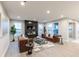 Modern living room features a fireplace, large windows, and comfortable seating at 9184 Anthem Ave, Plainfield, IN 46168