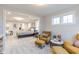 The primary suite provides a large sitting room with comfortable seating and plenty of bright natural light at 9184 Anthem Ave, Plainfield, IN 46168