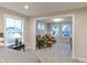 The spacious sitting room has bright natural light, and two chairs with ottomans, perfect for relaxation at 9184 Anthem Ave, Plainfield, IN 46168
