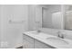 Bright bathroom featuring a double vanity with modern fixtures and a large mirror at 9198 Anthem Ave, Plainfield, IN 46168