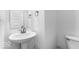 Bathroom featuring pedestal sink, round mirror, and white toilet at 9198 Anthem Ave, Plainfield, IN 46168