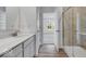 Modern bathroom featuring a single sink, walk in shower and view into adjacent bedroom at 9198 Anthem Ave, Plainfield, IN 46168
