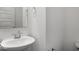 This bathroom has a pedestal sink, a stylish mirror, and modern fixtures at 9198 Anthem Ave, Plainfield, IN 46168