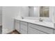 Modern bathroom featuring double sink vanity, bright lighting, and tiled shower at 9198 Anthem Ave, Plainfield, IN 46168
