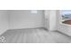 This bedroom features carpeted floors and a window for natural light at 9198 Anthem Ave, Plainfield, IN 46168