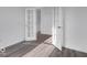Bright bedroom featuring stylish gray floors and elegant doors leading to other rooms at 9198 Anthem Ave, Plainfield, IN 46168
