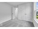 Bedroom featuring plush gray carpet, white walls and an entrance to adjacent rooms at 9198 Anthem Ave, Plainfield, IN 46168