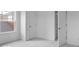 This bedroom features plush carpet, a window, neutral walls, and closet doors at 9198 Anthem Ave, Plainfield, IN 46168