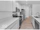 Modern kitchen featuring stainless steel appliances, light countertops, and sleek hardware at 9198 Anthem Ave, Plainfield, IN 46168