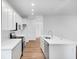 Modern kitchen with white cabinetry, stainless steel appliances, and a large center island at 9198 Anthem Ave, Plainfield, IN 46168