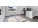 Bright kitchen with stainless steel appliances, white cabinets, and large bright windows at 9198 Anthem Ave, Plainfield, IN 46168