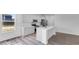 Modern kitchen features stainless steel appliances, an island, and bright, white cabinetry at 9198 Anthem Ave, Plainfield, IN 46168