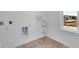 A well-lit laundry room with connections and a window at 9198 Anthem Ave, Plainfield, IN 46168