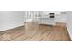 Spacious living room area with wood floors, bright natural light and neutral walls, adjacent to kitchen at 9198 Anthem Ave, Plainfield, IN 46168