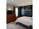 Bedroom featuring a wood bed frame and a 