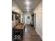 Inviting entryway with wood floors, decorative accents, and a view of the front door at 943 Rushmore Dr, Pittsboro, IN 46167