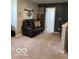A cozy loft space with a loveseat on the second floor at 943 Rushmore Dr, Pittsboro, IN 46167