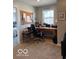 A home office space is well-lit by natural light, offering a cozy place to work at 943 Rushmore Dr, Pittsboro, IN 46167