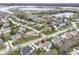 Aerial view of home and the surrounding neighborhood near a lake at 10580 Saddlestone Dr, Fishers, IN 46040