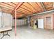 Unfinished basement with exposed beams, concrete floor, and utilitarian features at 10580 Saddlestone Dr, Fishers, IN 46040